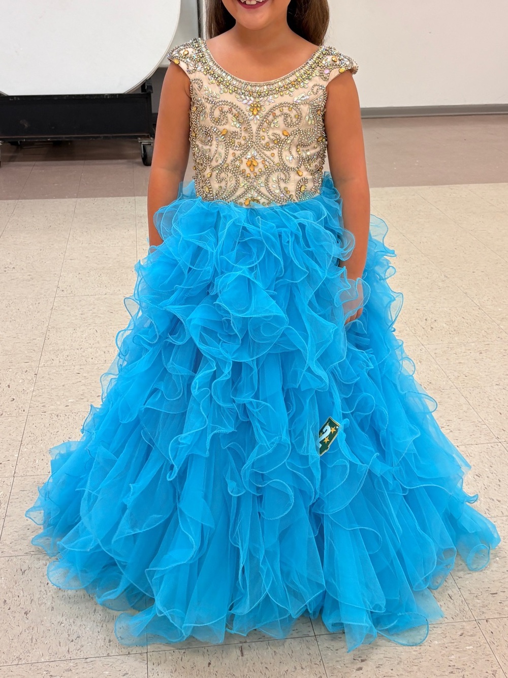 Girls Blue Ruffled Tulle Pageant Dress with Embellished Ivory Bodice
46 inches